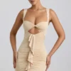 Zivanka Slinky Jersey Cut-Out Ruffle-Trim Mini Dress in Buttercream Zivanka Slinky Jersey Cut-Out Ruffle-Trim Mini Dress in Buttercream