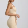 Zivanka Slinky Jersey Cut-Out Ruffle-Trim Mini Dress in Buttercream Zivanka Slinky Jersey Cut-Out Ruffle-Trim Mini Dress in Buttercream
